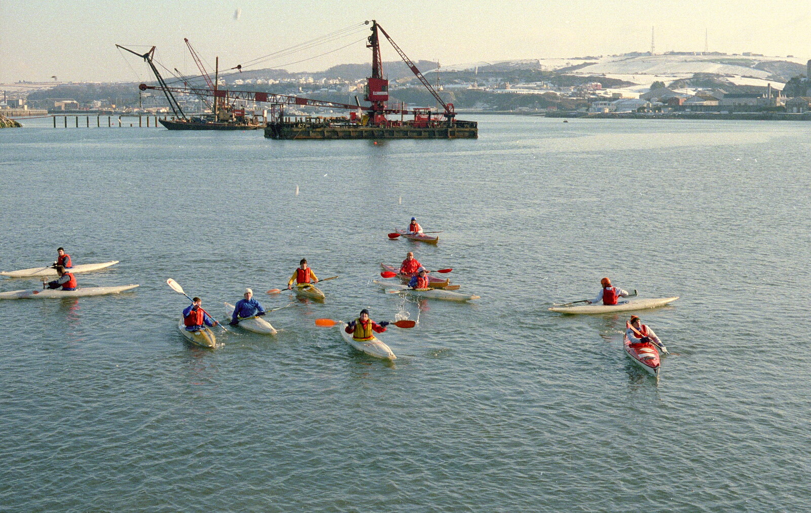 The Canoe Club, out on the Sound. Note the snow on the hills from Uni: Canoe Society RAG Raft Madness, Plymouth Sound - 1st March 1986