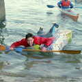 Paddling in on a raft made of Tesco carrier bags, Uni: Canoe Society RAG Raft Madness, Plymouth Sound - 1st March 1986
