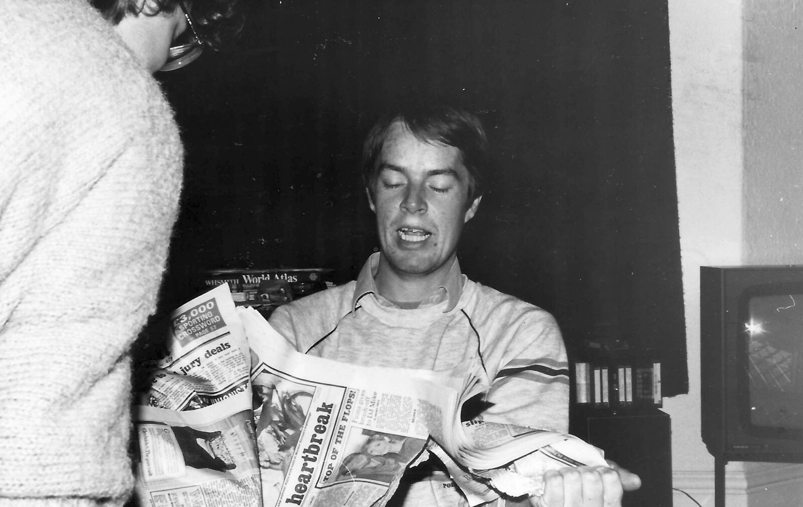 Malcolm rips up a newspaper from Uni: The First Year in Black and White, Plymouth Polytechnic, Devon - 8th April 1986