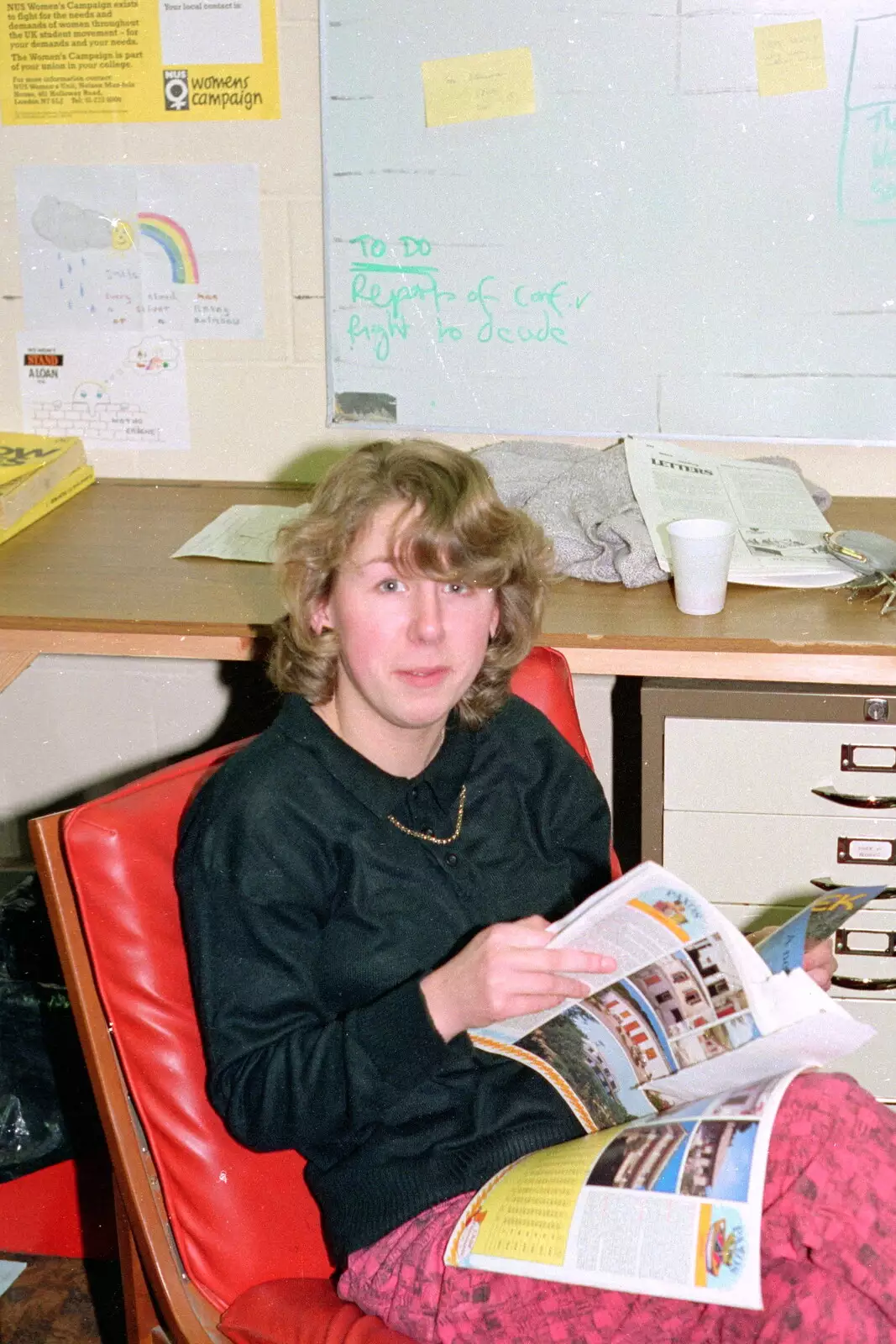 More back office holiday brochure browsing, from Uni: PPSU Office Staff and a Night in the Students' Union Bar, Plymouth - 15th March 1986