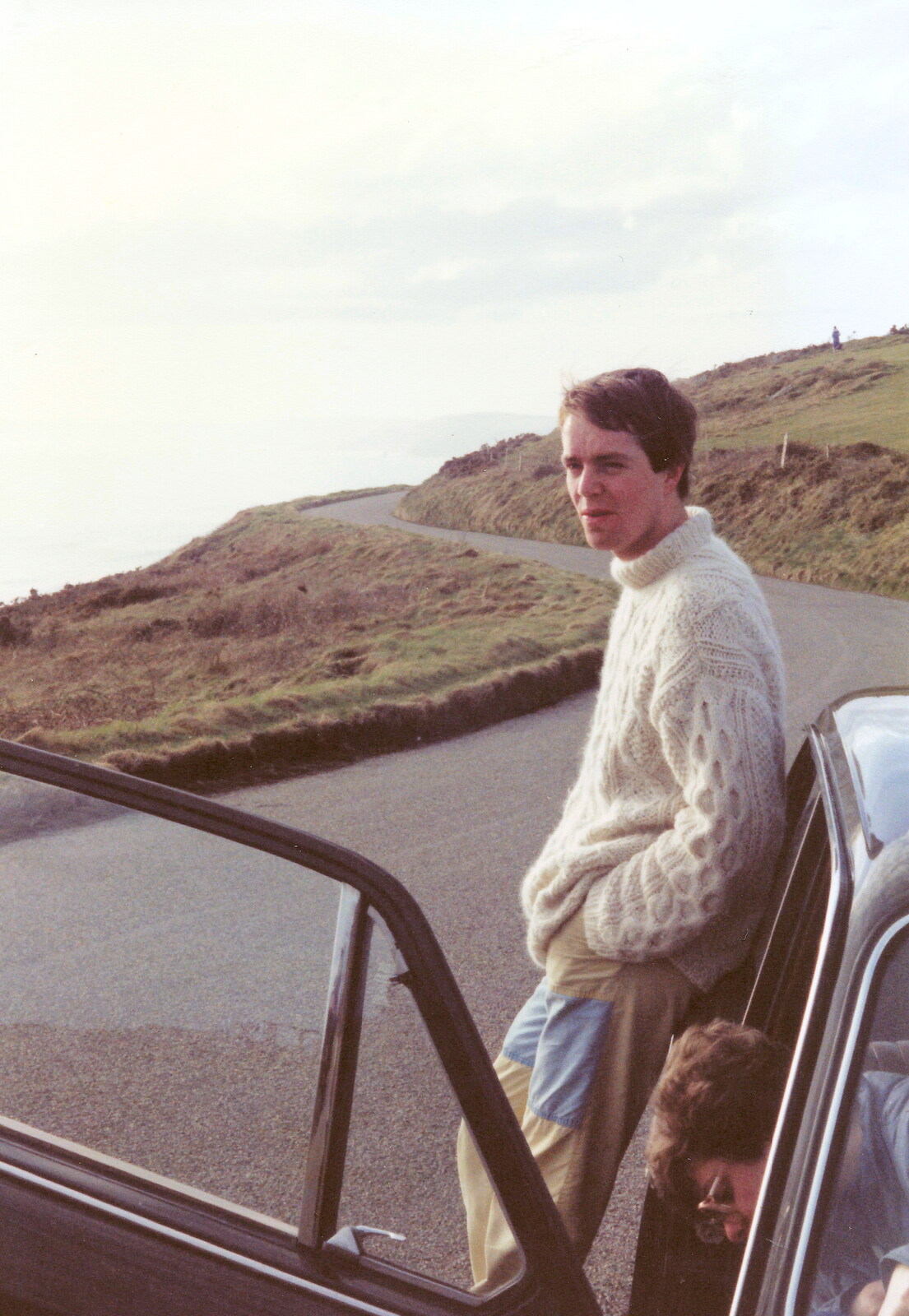 Malcolm leans on Barbara's car from Uni: The End of Term and Whitsand Bay, Plymouth and New Milton - 21st March 1986
