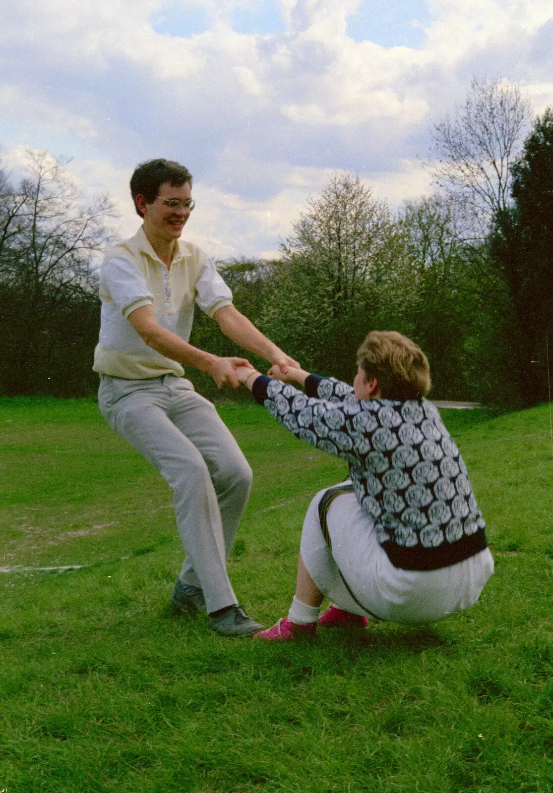 Phil pulls Anna up, from A Trip to Trinity College, Cambridge - 23rd March 1986