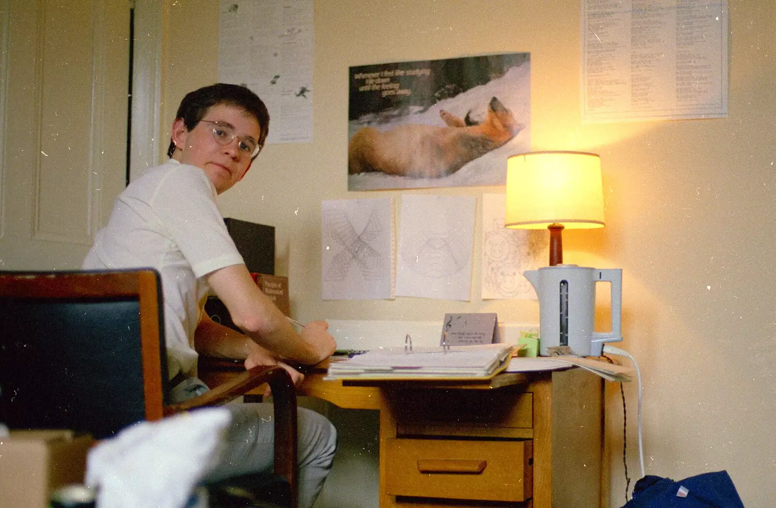 Phil looks back from his desk, from A Trip to Trinity College, Cambridge - 23rd March 1986