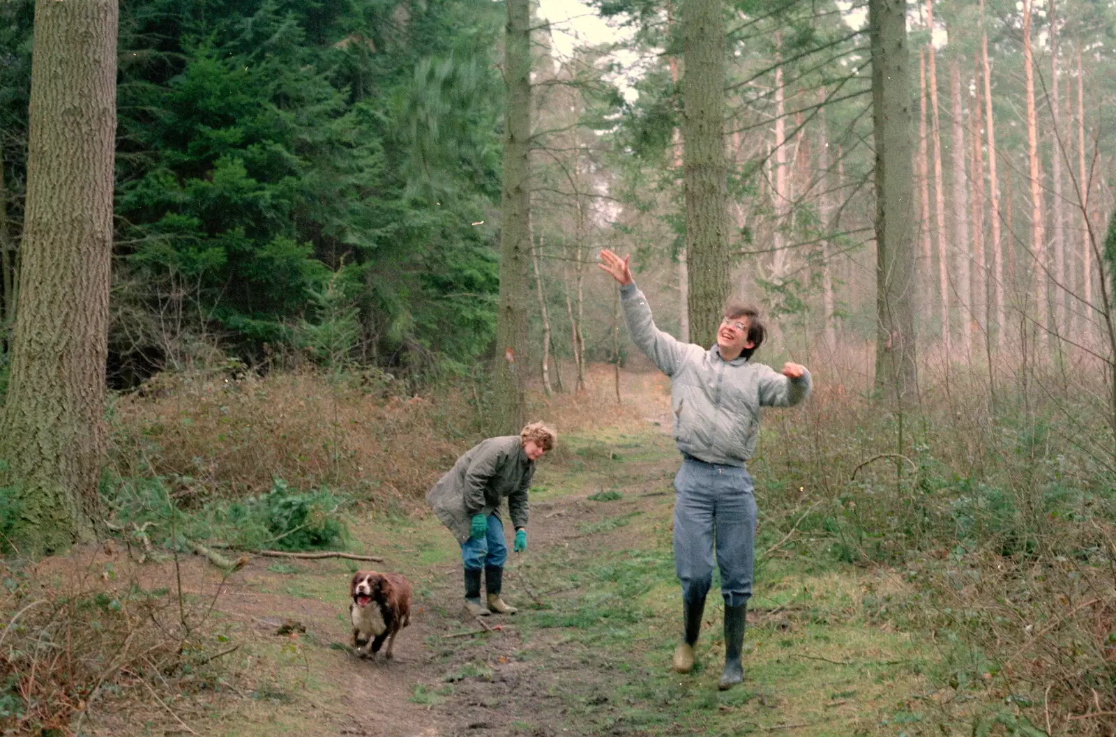 Phil lobs a stick up in to the air as the dog chases it, from A CB Reunion and a Trip to the Beach, Barton on Sea, Hampshire - 4th April 1986