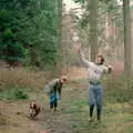 Phil lobs a stick up in to the air as the dog chases it, A CB Reunion and a Trip to the Beach, Barton on Sea, Hampshire - 4th April 1986