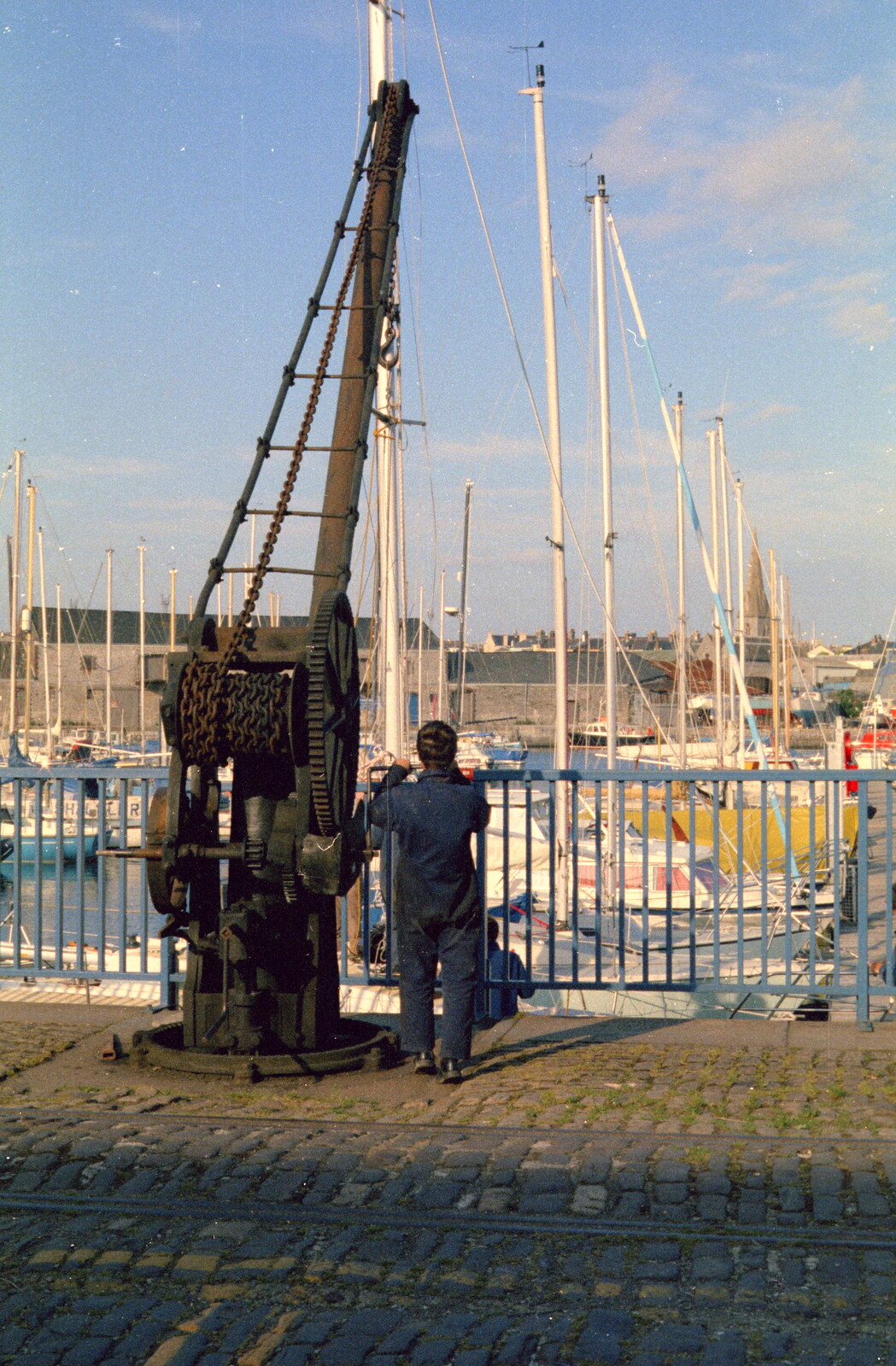 Someone pauses by an old crane from Uni: Scenes of Plymouth and the PPSU Bar, Plymouth Polytechnic, Devon - 28th April 1986