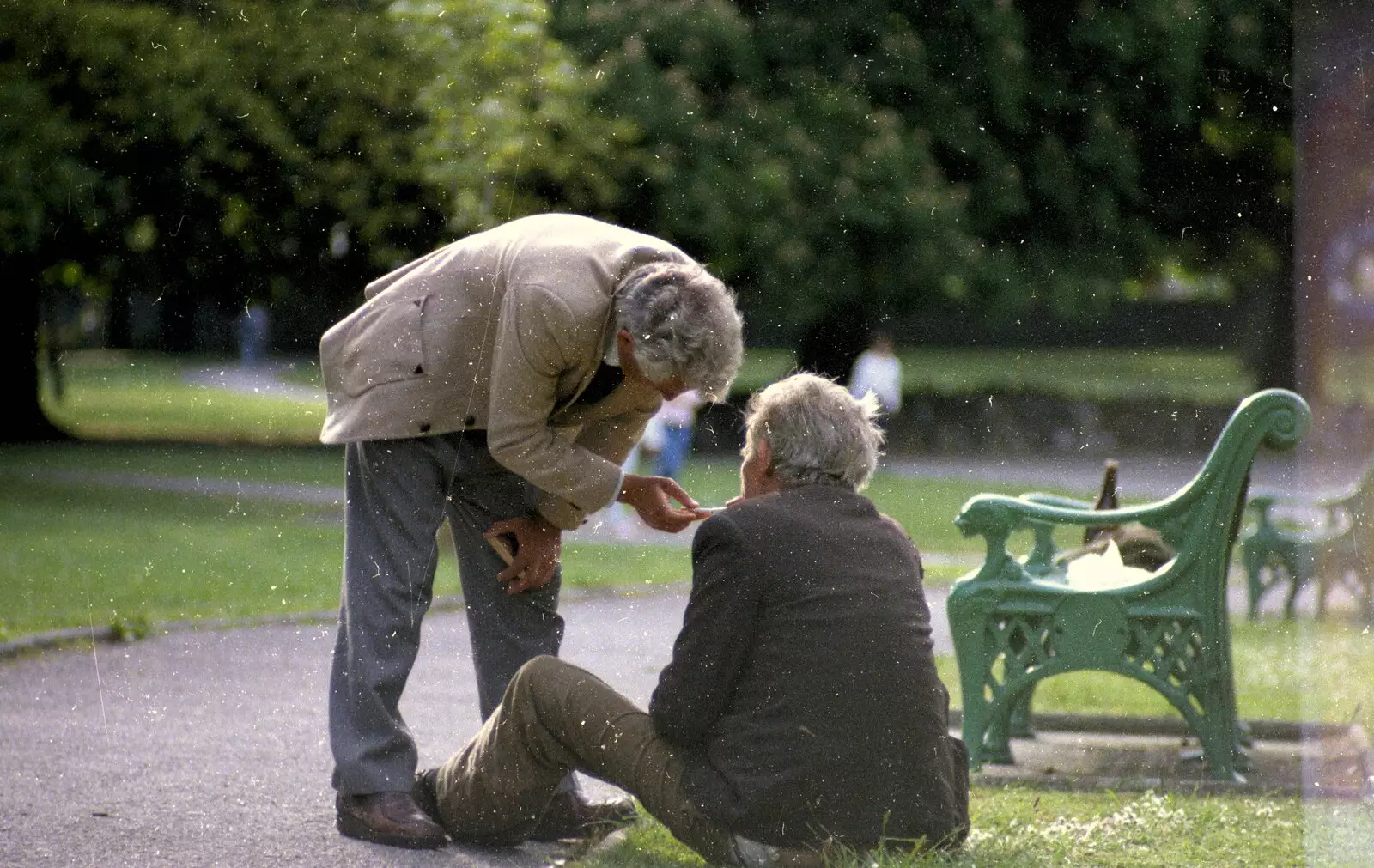 Two tramps help each other with a cigarette, from Uni: Scenes of Plymouth and the PPSU Bar, Plymouth Polytechnic, Devon - 28th April 1986