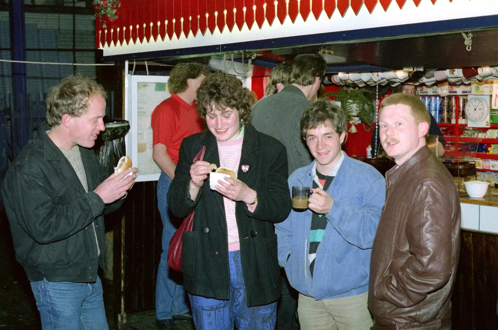 Angela considers a Jasper-burger, from Uni: Night and Day on the Barbican, Plymouth, Devon - 1st May 1986