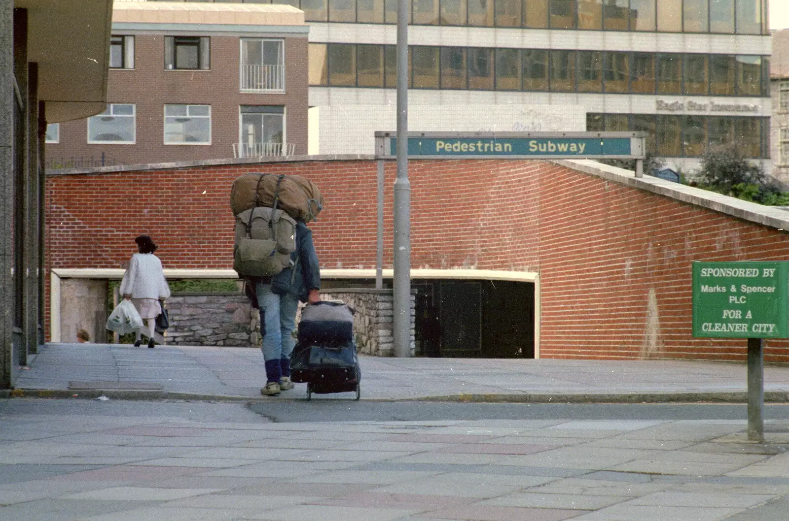 The tramp heads off to Mayflower Street underpass, from Uni: A Plymouth Hoe Panorama, Plymouth, Devon - 7th May 1986