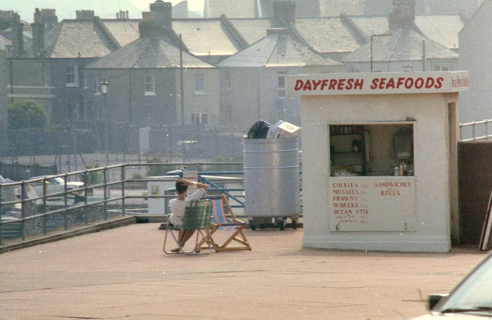 A woman waits outside Dayfresh Seafoods, from Uni: Phil and Anna Visit Nosher, Plymouth, Devon - 18th May 1986