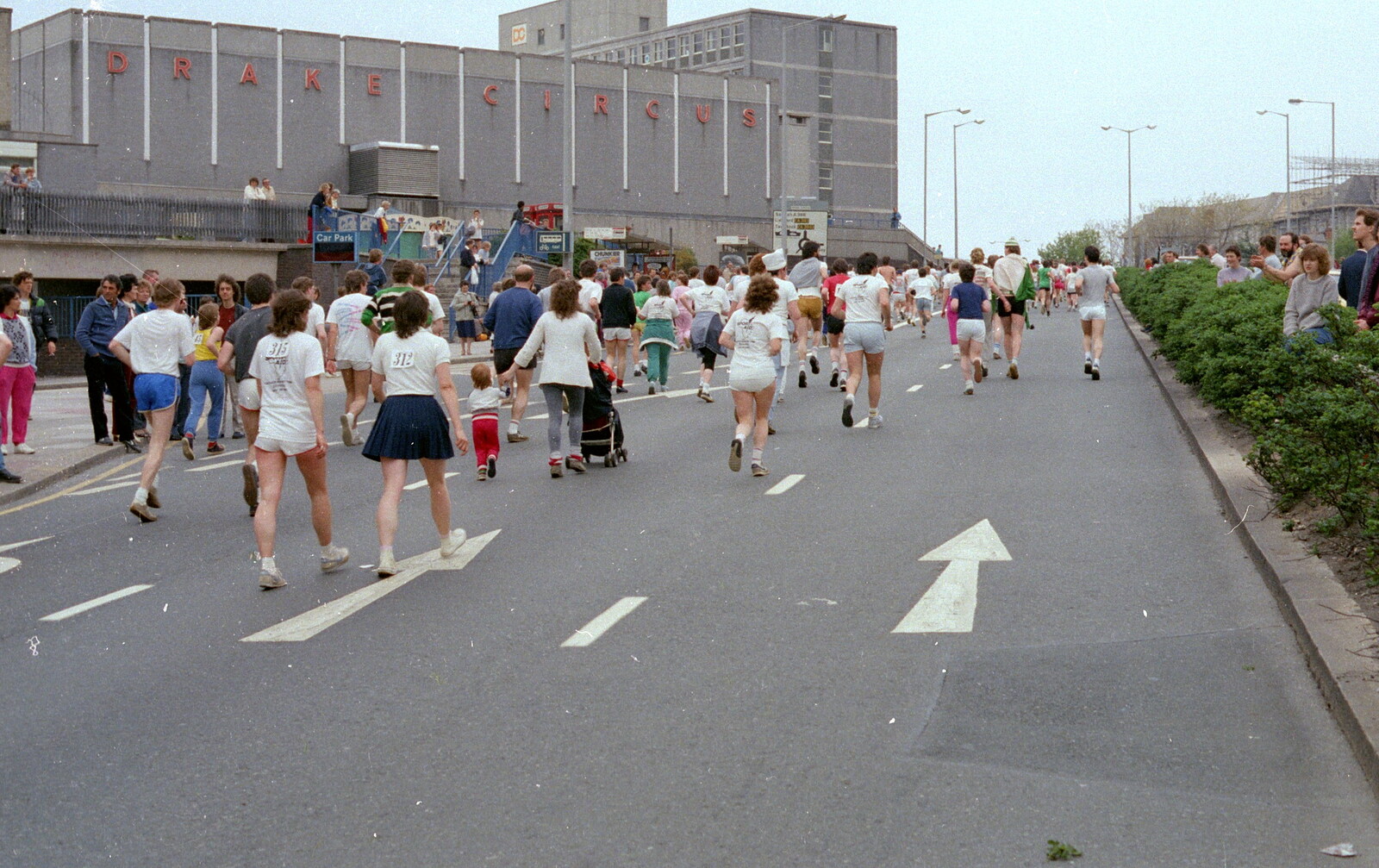 Some runners head up past Drake Circus from Uni: Sport Aid - Run The World, Plymouth, Devon - 25th May 1986