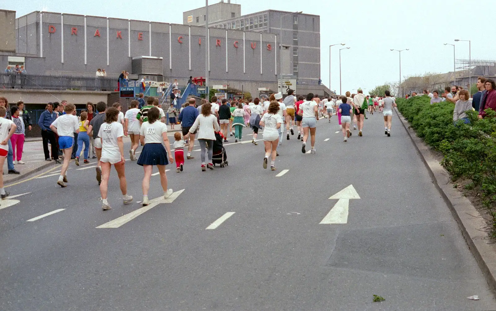 Some runners head up past Drake Circus, from Uni: Sport Aid - Run The World, Plymouth, Devon - 25th May 1986