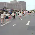 Some runners head up past Drake Circus, Uni: Sport Aid - Run The World, Plymouth, Devon - 25th May 1986