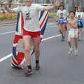 A runner hauls around a Union Flag, Uni: Sport Aid - Run The World, Plymouth, Devon - 25th May 1986