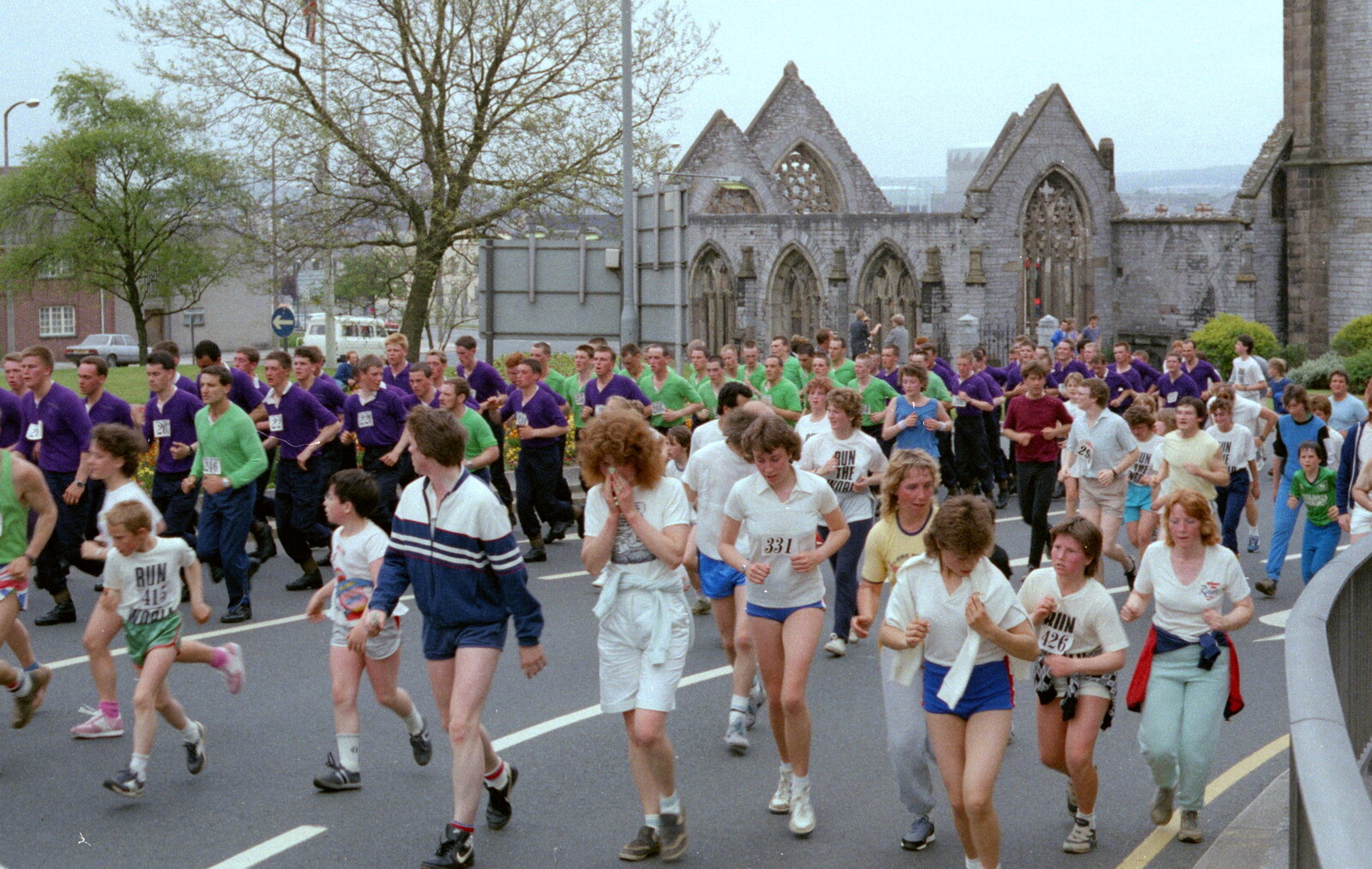 A couple of platoons of marines in purple and green from Uni: Sport Aid - Run The World, Plymouth, Devon - 25th May 1986