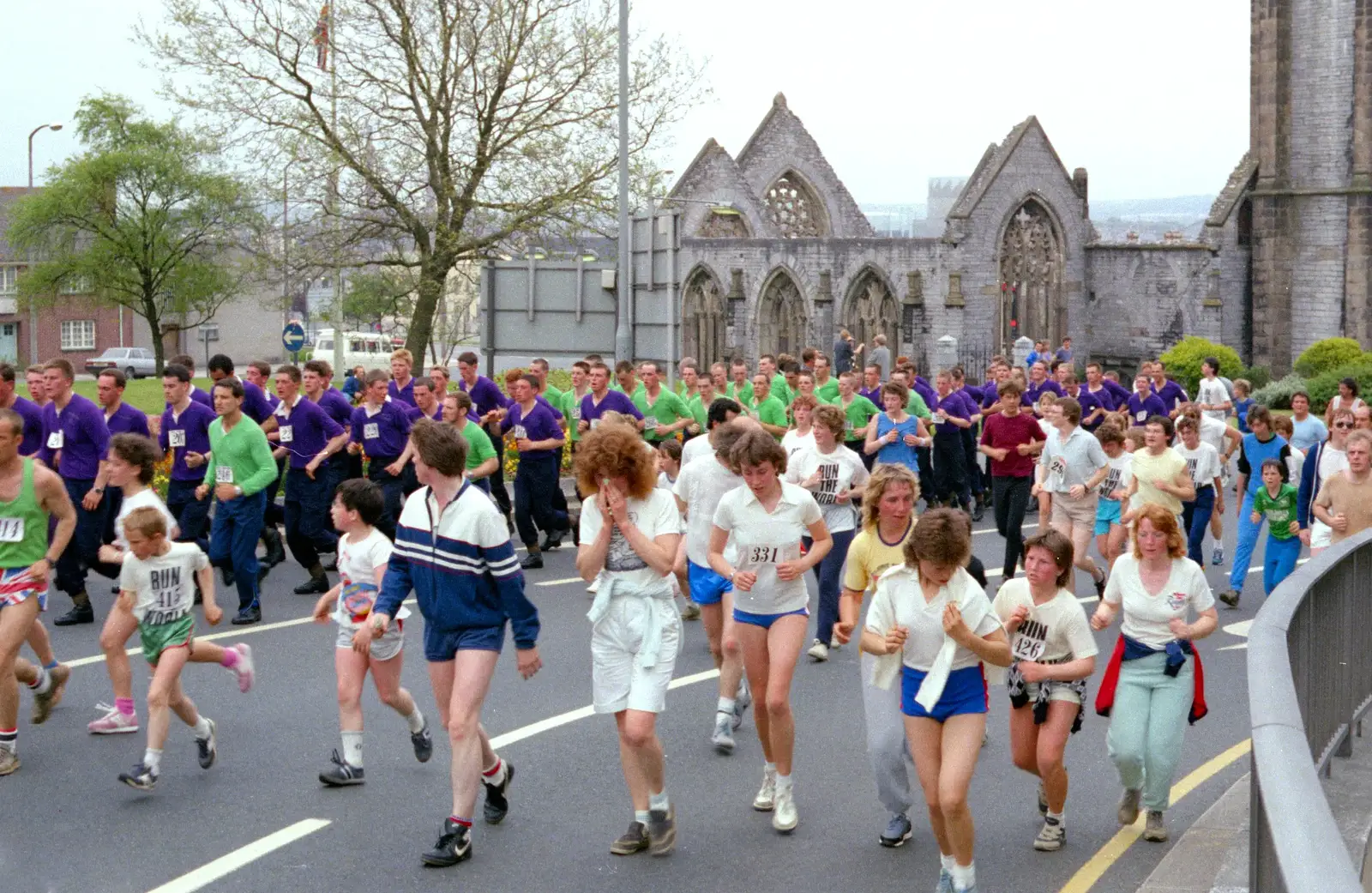 A couple of platoons of marines in purple and green, from Uni: Sport Aid - Run The World, Plymouth, Devon - 25th May 1986