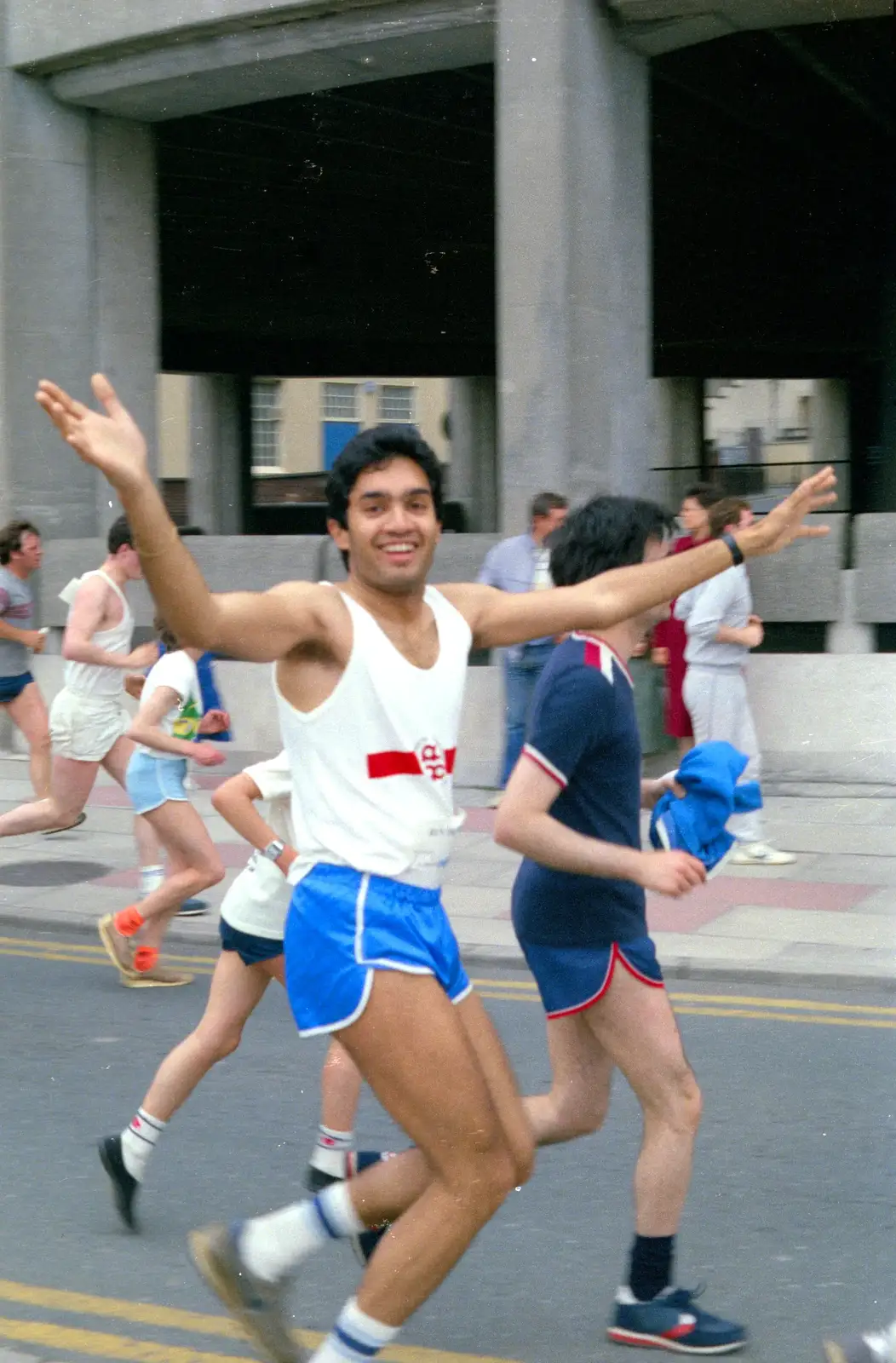 Anand runs past Drake Circus car park, from Uni: Sport Aid - Run The World, Plymouth, Devon - 25th May 1986