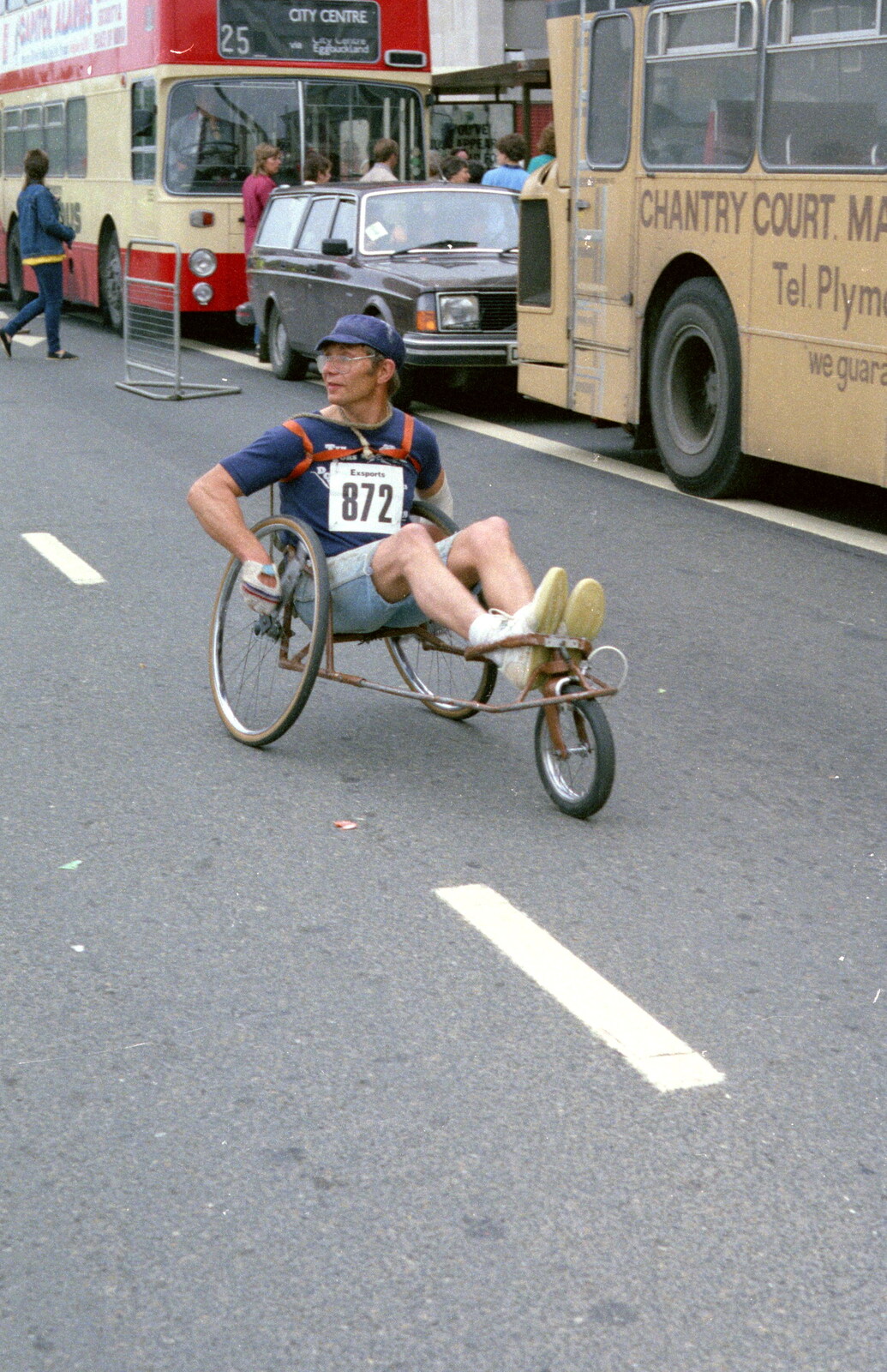 A dude on a recumbent wheelchair from Uni: Sport Aid - Run The World, Plymouth, Devon - 25th May 1986