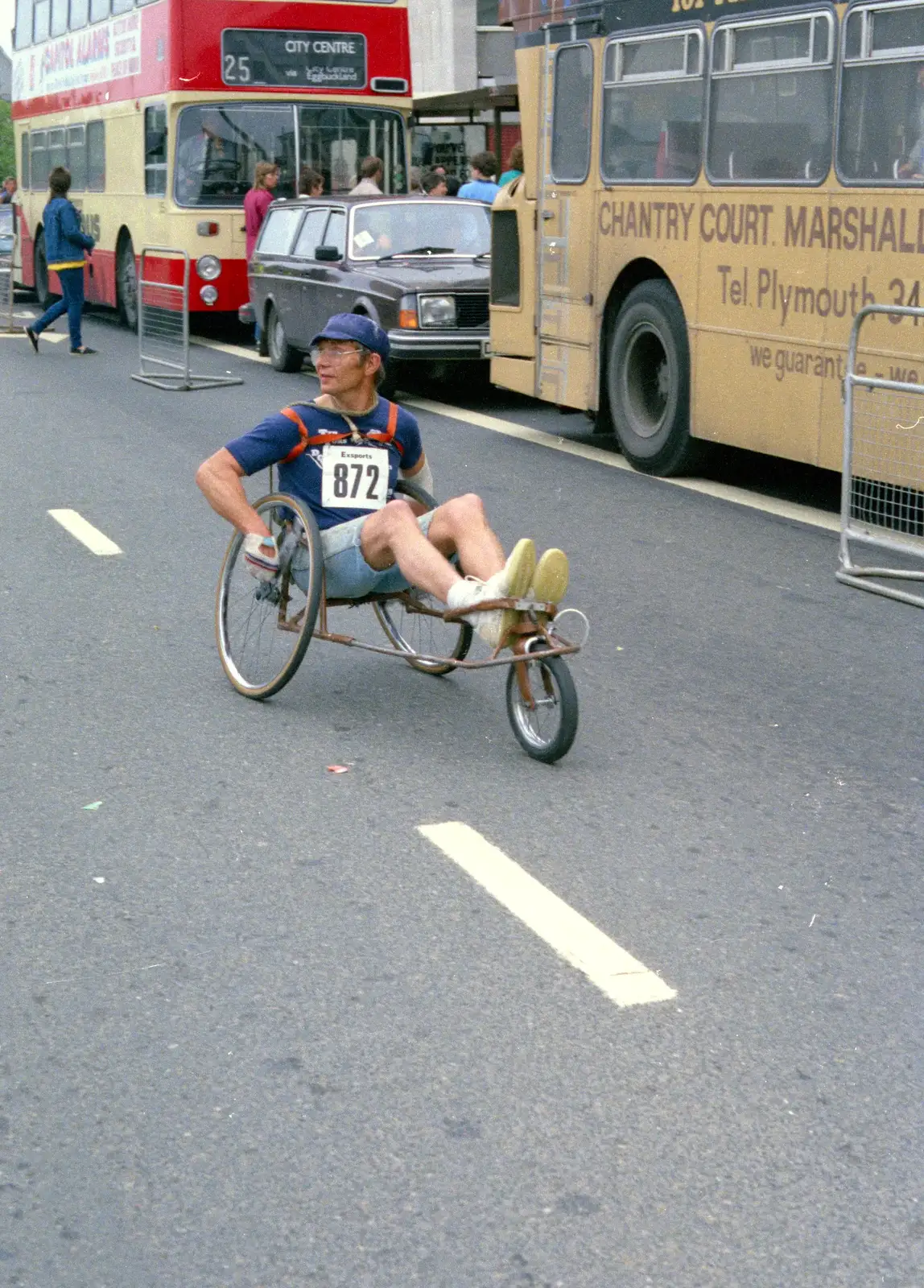 A dude on a recumbent wheelchair, from Uni: Sport Aid - Run The World, Plymouth, Devon - 25th May 1986