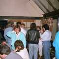 1986 People mill around in the conservatory