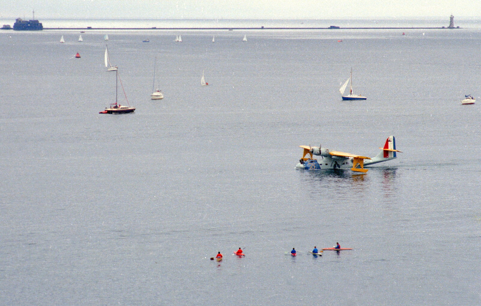 Uni: The Navy-Curtiss NC-4 Trans-Atlantic Flight, Plymouth Sound - 31st May 1986: Canoeists float around, watching
