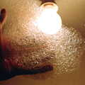 1986 A ball of bath foam is held up to the light