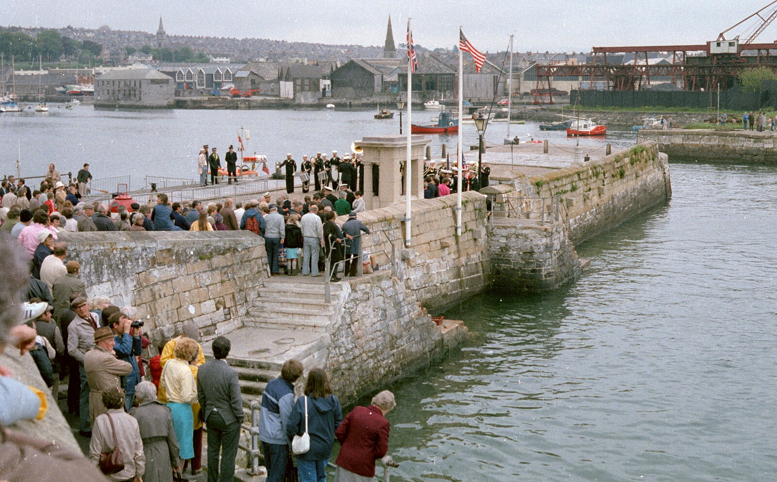 Uni: The Navy-Curtiss NC-4 Trans-Atlantic Flight, Plymouth Sound - 31st May 1986: Crowds wait on the Mayflower Steps, whilst the band plays