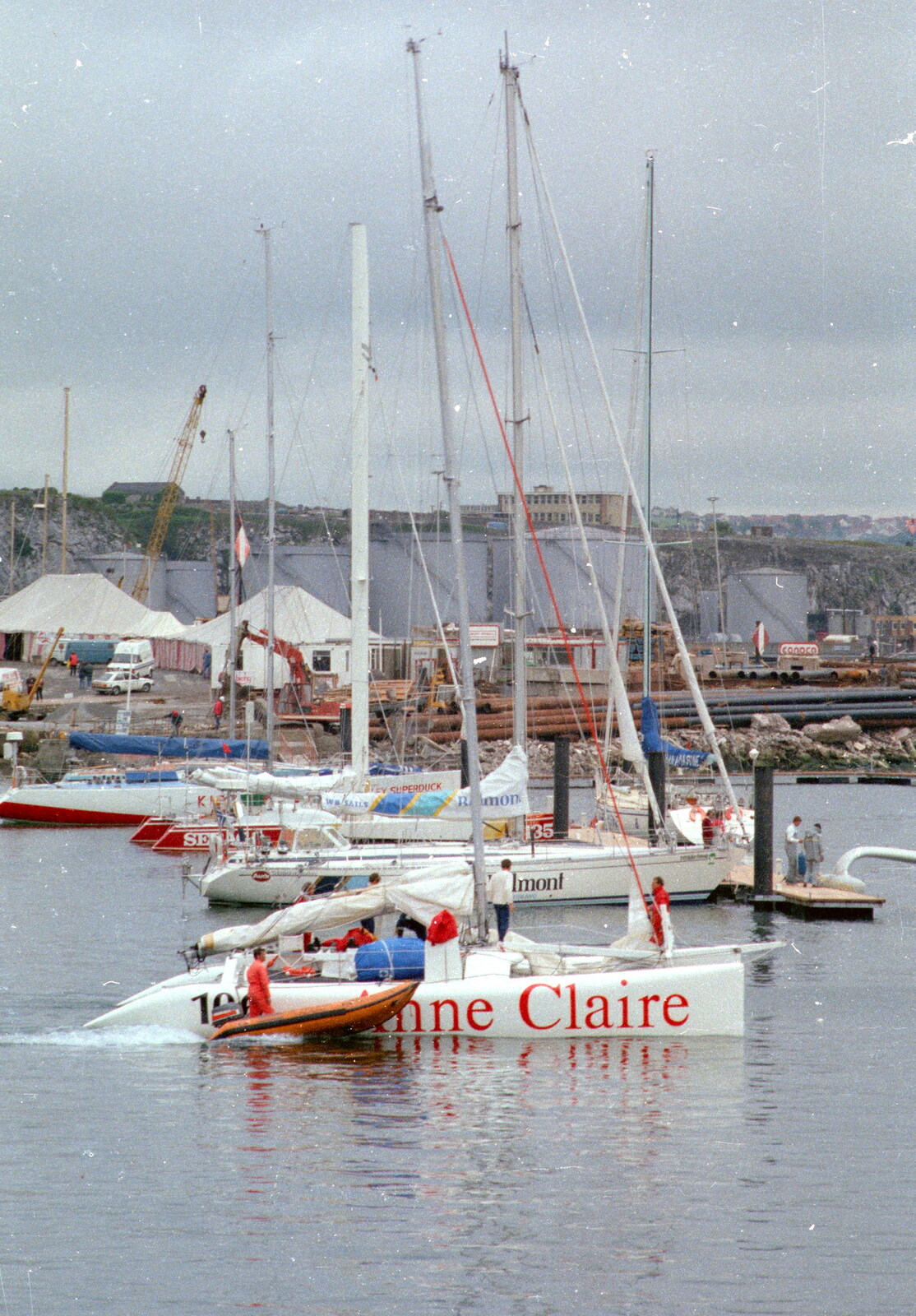 Uni: The Navy-Curtiss NC-4 Trans-Atlantic Flight, Plymouth Sound - 31st May 1986: A RIB buzzes by the racing catamaran 'Anne Claire'