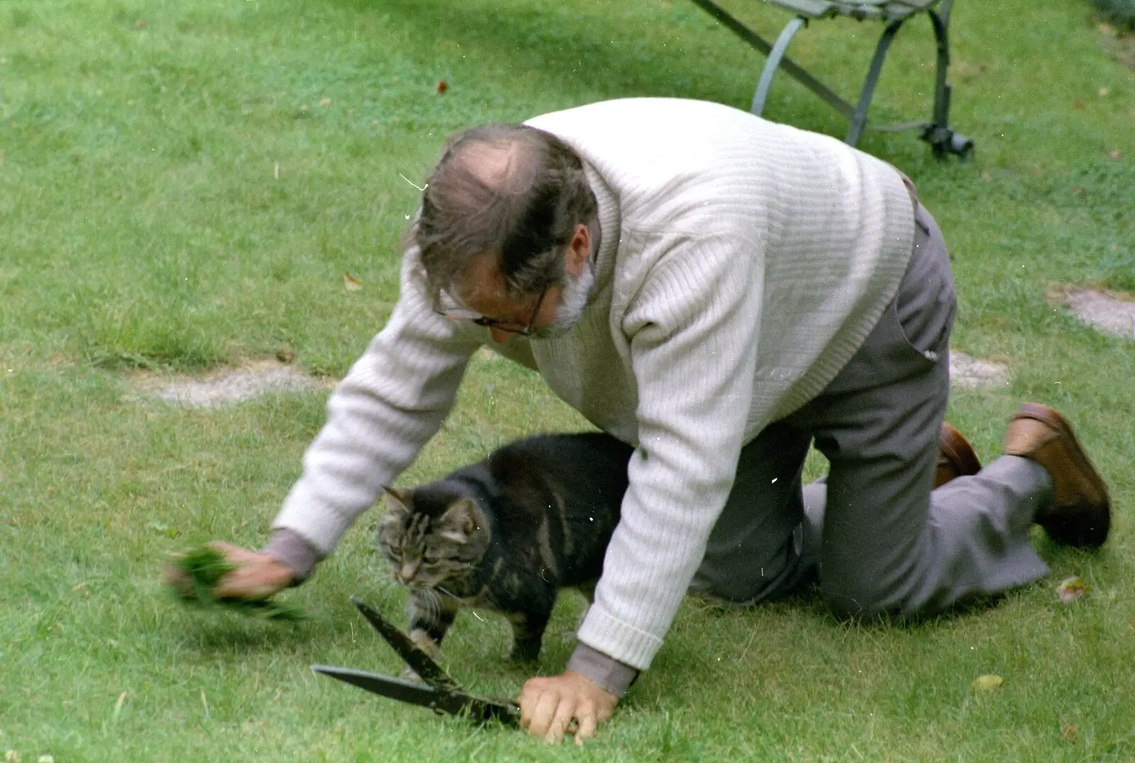 Andy follows Fleabag around the lawn, from A Ford Cottage Miscellany, Barton on Sea, Hampshire - 7th July 1986