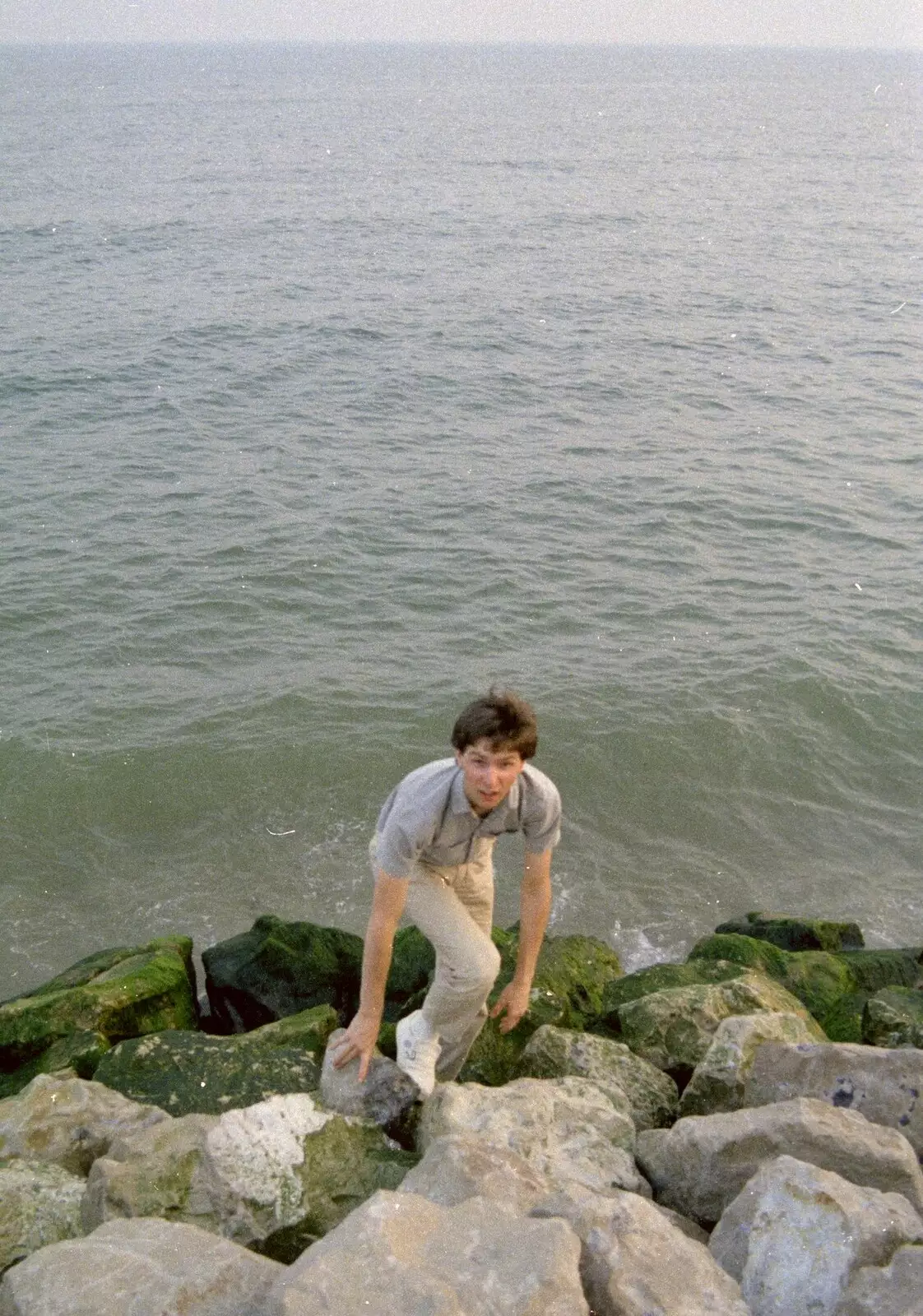 Sean clambers up the rocks, from On the Beach Again and the CB Gang at the Pub, Barton on Sea and Hordle, Hampshire - 12th July 1986