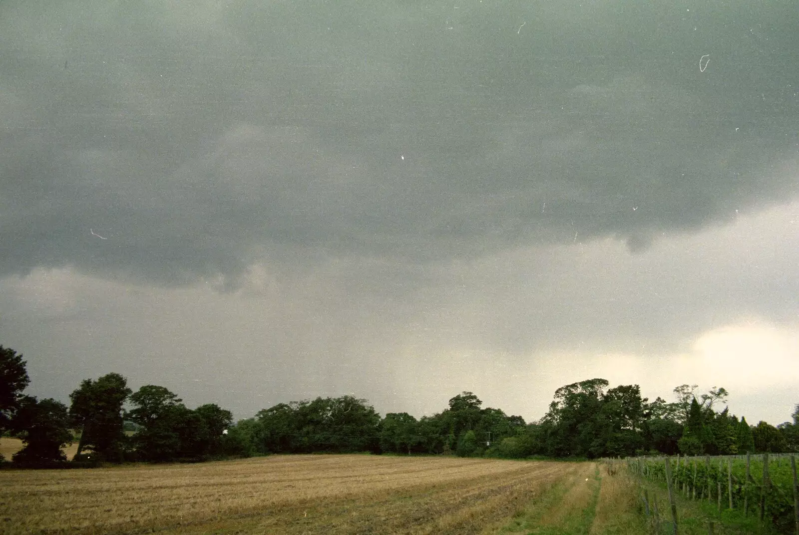 Dark skies over the field next to the vineyard, from A Vineyard Miscellany, Bransgore and the New Forest - 18th July 1986