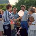 Sean hands out balloons, Sean and the New Milton Carnival, Hampshire - 1st August 1986