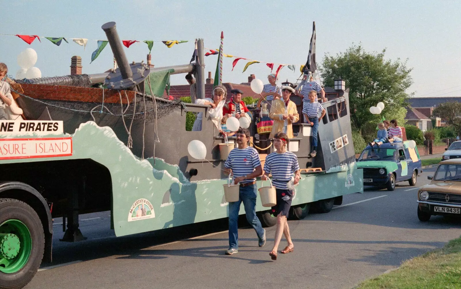 Sean walks along by the McCarthy and Stone float, from Sean and the New Milton Carnival, Hampshire - 1st August 1986