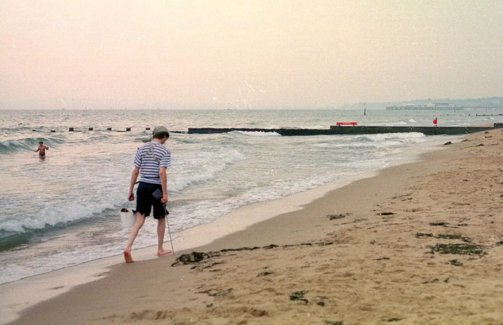 Sean walks up the beach with his sword in hand, from McCarthy and Stone and the Bournemouth Carnival, Dorset - 8th August 1986