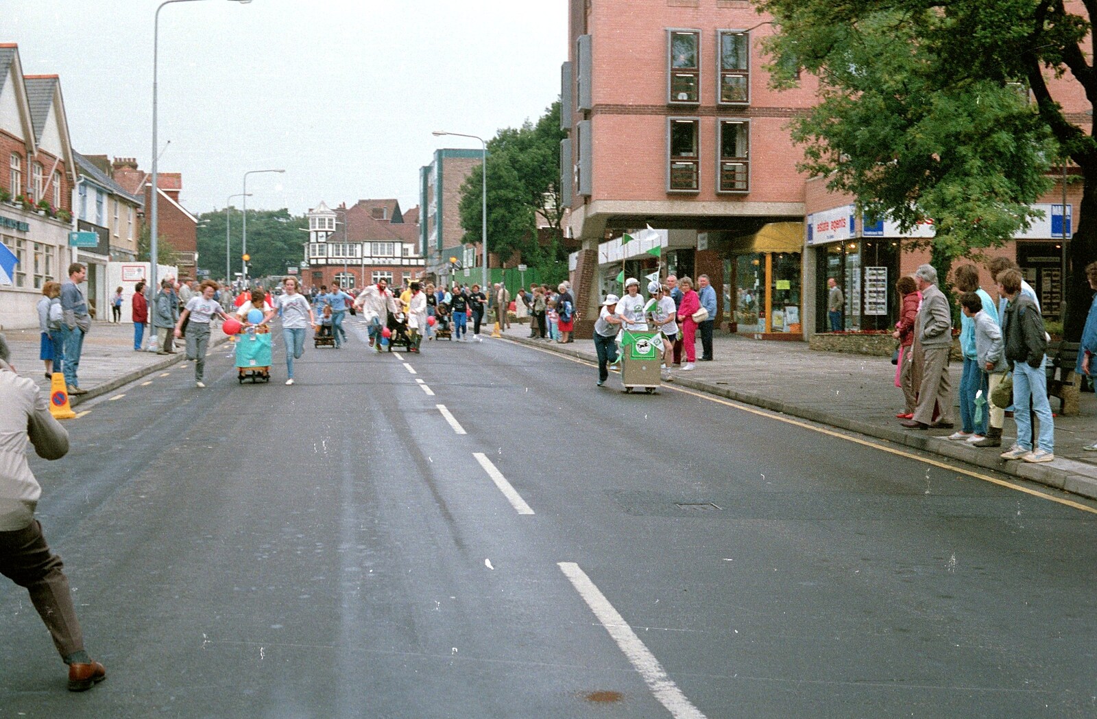 The Fun Run goes past Barclays Bank from The New Forest Marathon, New Milton, Hampshire - 14th September 1986