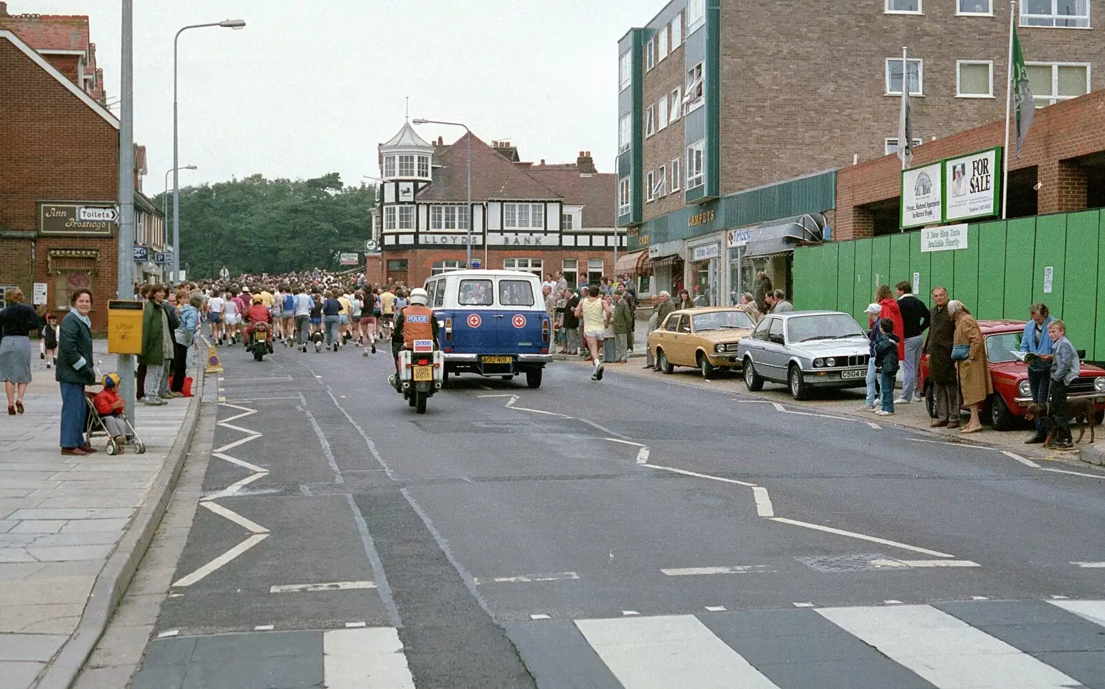 The runners, support van and a motorbike rozzer, from The New Forest Marathon, New Milton, Hampshire - 14th September 1986