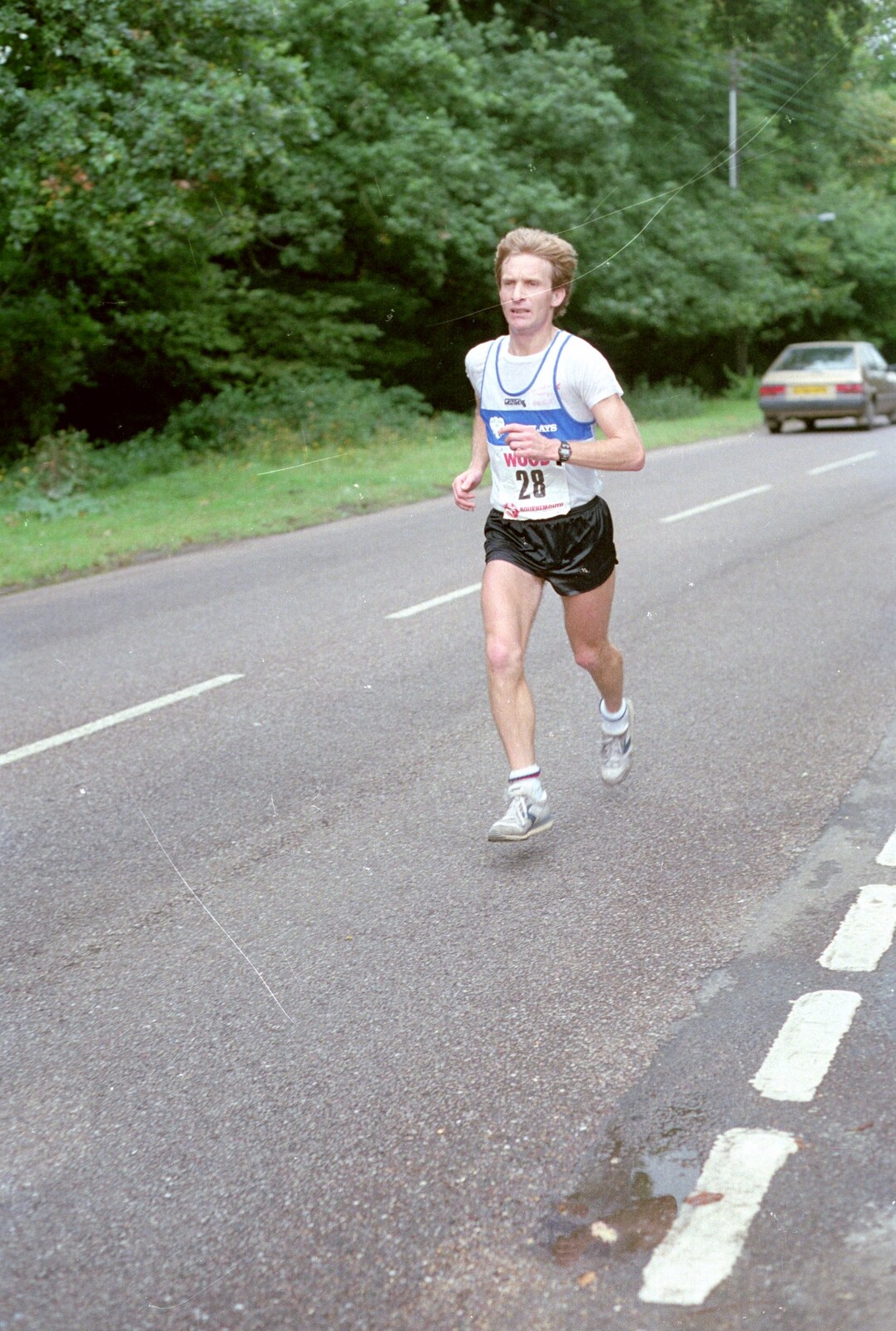 A marathon runner legs it through Brockenhurst from The New Forest Marathon, New Milton, Hampshire - 14th September 1986