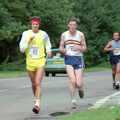 More runners pass through Brockenhurst, The New Forest Marathon, New Milton, Hampshire - 14th September 1986