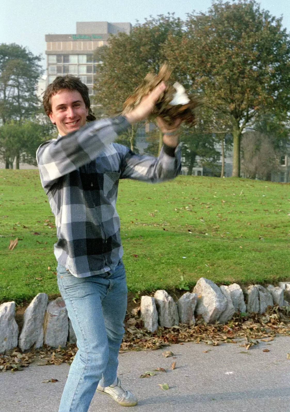 Riki prepares to lob a pile of leaves at Nosher, from Uni: A Plymouth Hoe Kickabout, Plymouth, Devon - 20th October 1986