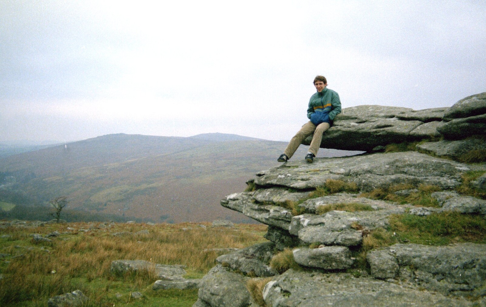 Dave 'Trotsky' Mallett sits on a granite outcrop from Uni: A Trip to Venford Resevoir, Dartmoor, Devon - 18th January 1987