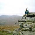 Dave 'Trotsky' Mallett sits on a granite outcrop, Uni: A Trip to Venford Resevoir, Dartmoor, Devon - 18th January 1987