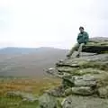 Dave 'Trotsky' Mallett sits on a granite outcrop, Uni: A Trip to Venford Resevoir, Dartmoor, Devon - 18th January 1987