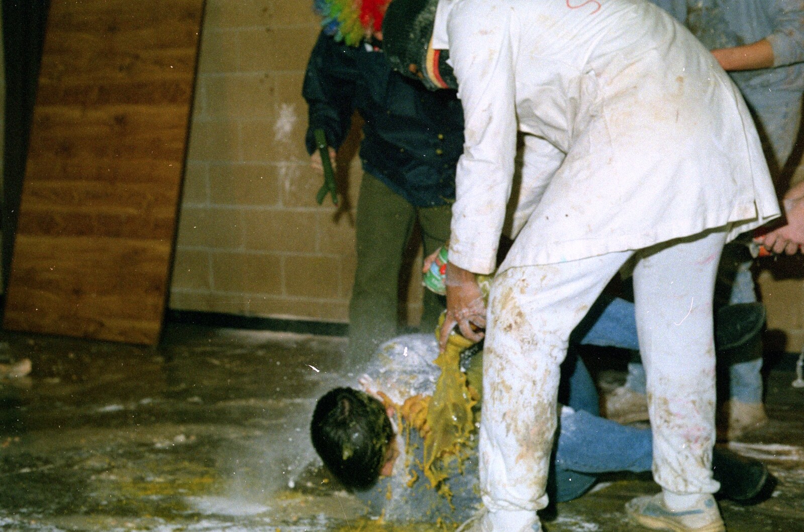 Unspeakable yellow goo is poured over a vitim from Uni: The Pirate RAG Hit Squad, Plymouth Polytechnic, Devon - 8th February 1987