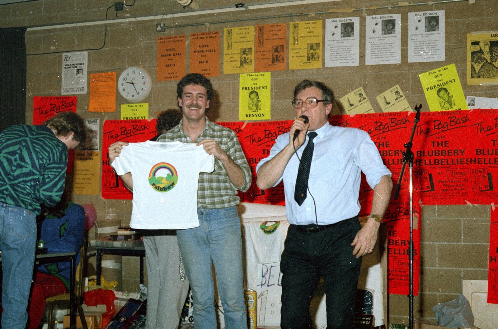 Sam Kennedy holds up a Rainbow teeshirt from Uni: Pirate RAG Bash, Games Nights and Brian's Beard, PPSU, Plymouth - 10th February 1987