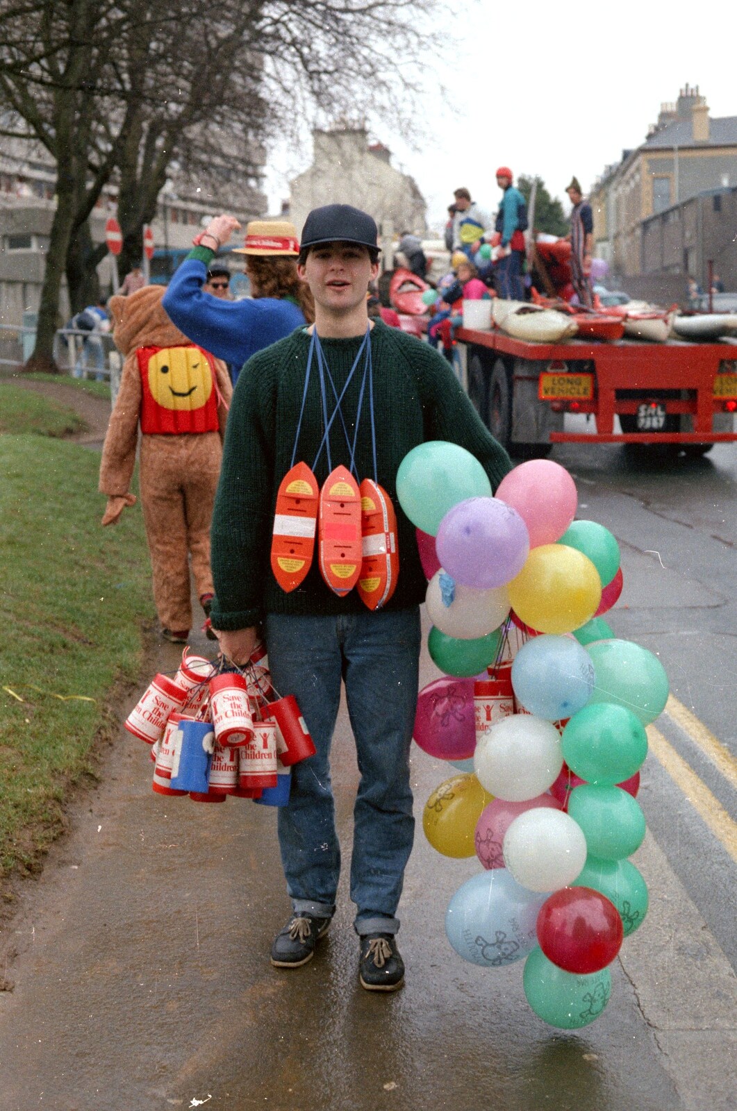 A dude with a load of balloons, on Portland Place from Uni: The PPSU Pirate RAG Parade, Plymouth, Devon - 14th February 1987