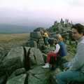 Riki sits on a tor and admires the view, A Trip to Trotsky's Mount, Dartmoor, Devon - 20th March 1987