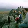 Riki sits on a tor and admires the view, A Trip to Trotsky's Mount, Dartmoor, Devon - 20th March 1987