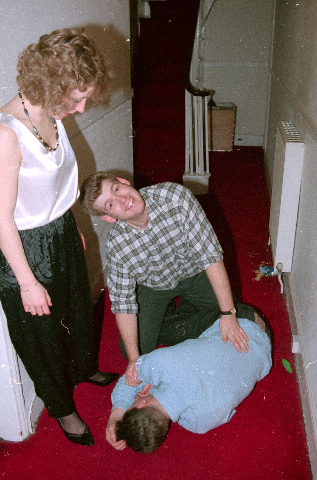 Richard helps out a collapsed partygoer from A Valentine Street Christmas, Norwich, Norfolk - 17th December 1987