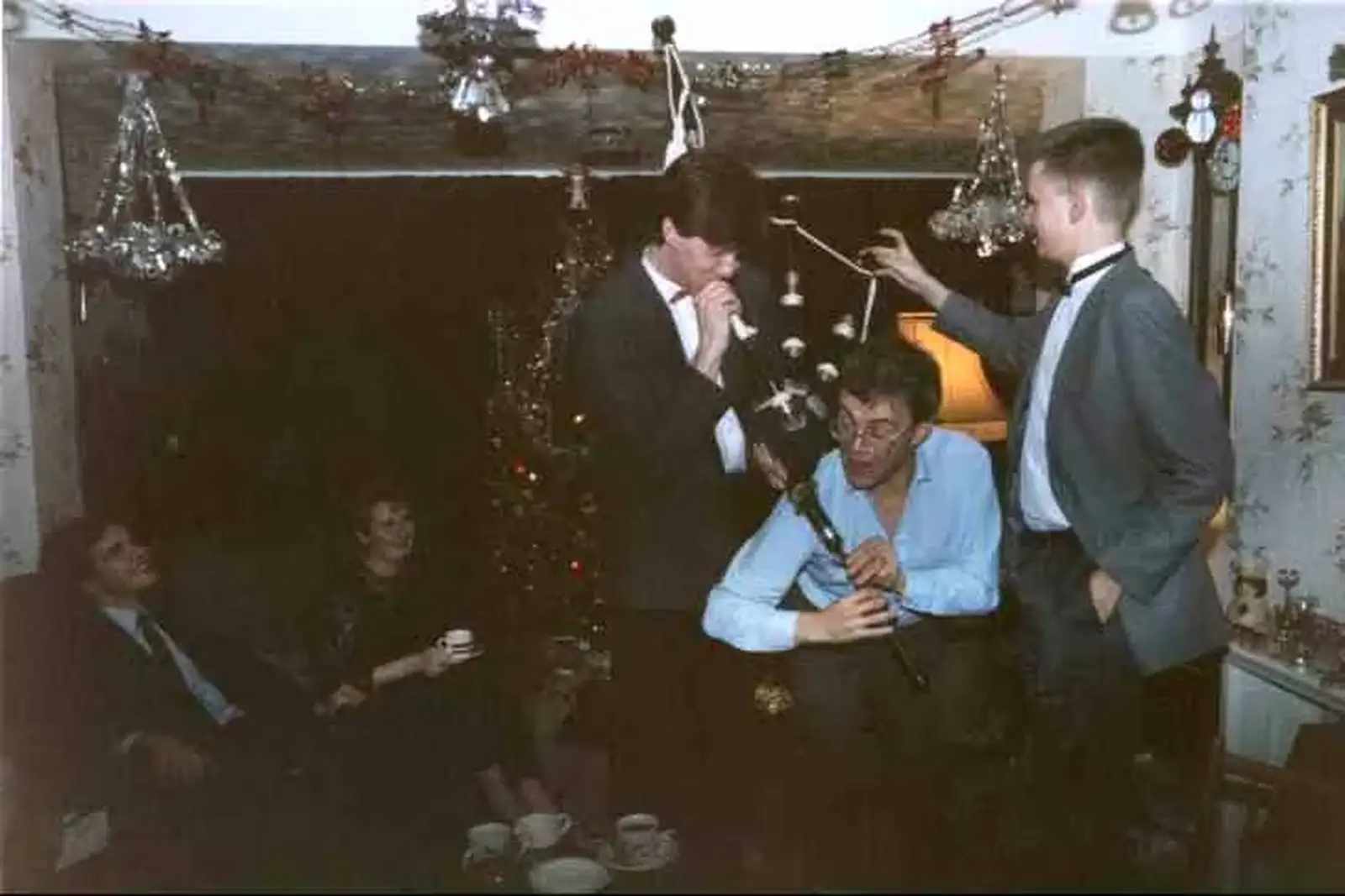Phil blows as Hamish's dad plays the chanter, from Hamish's 21st and Christmas, New Milton and Bransgore - 25th December 1987