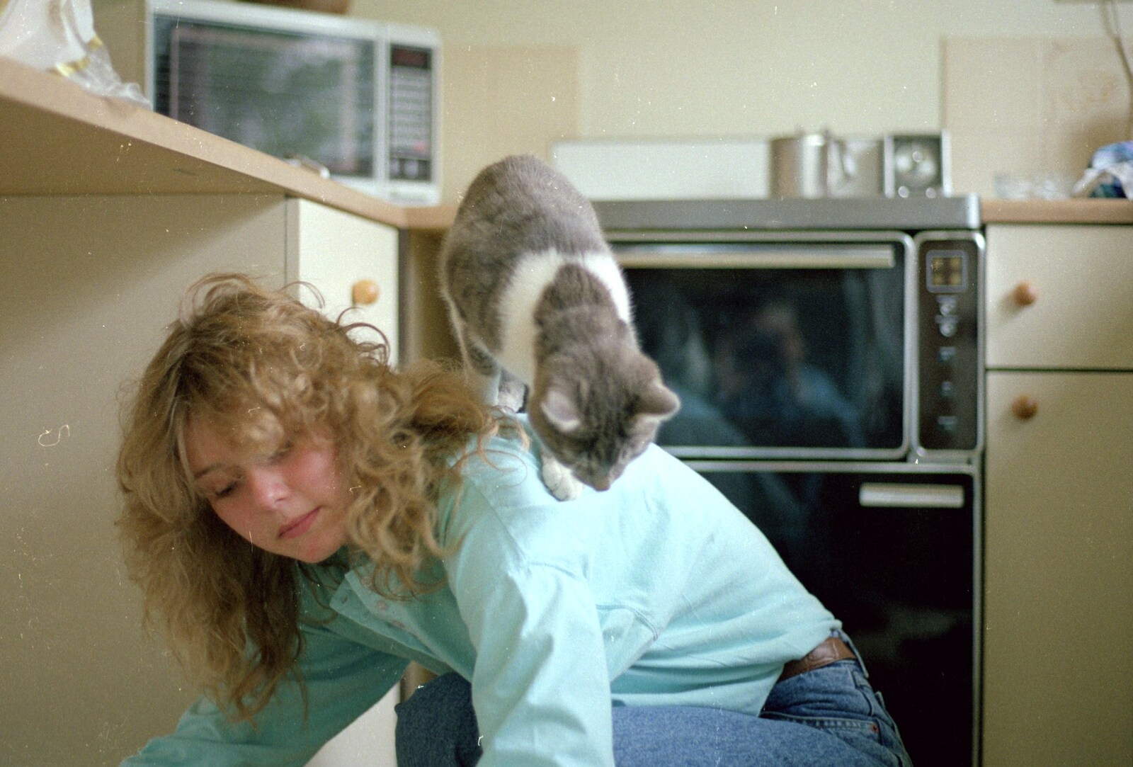 Over in Salhouse, A cat climbs all over Emma from Gus, the Sewell's Cottage Rabbit, Red House, Norfolk - 27th June 1988